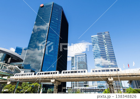 A train on the Wenhu or Brown Line of the Taipei MRT passes by the modern metropolis building in Nangang Software Park Area. A train on the Wenhu or Brown Line of the Taipei MRT passes by the modern metropolis building in Nangang Software Park Area. 138348826