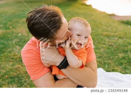 Father Kissing His Toddler During Outdoor Picnic Father Kissing His Toddler During Outdoor Picnic 138349146
