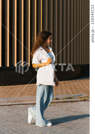 Teen Girl Walking Outdoors 138349152