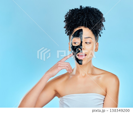 Skincare, charcoal mask and face of woman for facial treatment, anti aging and wellness in studio. Beauty mockup, dermatology and person for healthy skin, cosmetics and grooming on blue background Skincare, charcoal mask and face of woman for facial treatment, anti aging and wellness in studio. Beauty mockup, dermatology and person for healthy skin, cosmetics and grooming on blue background 138349200