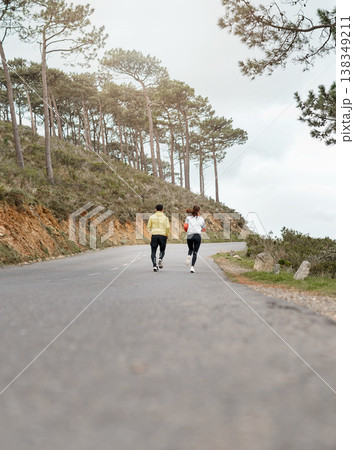 Running, back and exercise with couple in nature for workout partner, bonding and health. Fitness club, runner practice and wellness with man and woman outdoor for training and cardio challenge Running, back and exercise with couple in nature for workout partner, bonding and health. Fitness club, runner practice and wellness with man and woman outdoor for training and cardio challenge 138349211