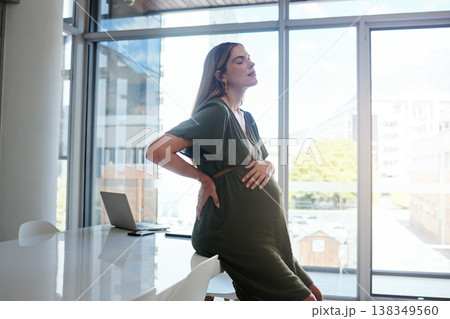 Pregnant, woman or back pain in office with stress, burnout and relax with eyes closed at desk or table. Person, pregnancy or hand on stomach for risk, anxiety or tired at professional company or job 138349560