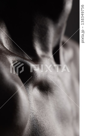 Collarbone, closeup and skin or body of man with muscle and cosmetics, health and model with glow from dermatology. Chest, shoulder and person with wellness in dark studio or black and white mockup 138349756