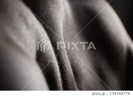 Skin, texture and closeup of man with muscle and cosmetics, health and model with glow from dermatology. Body, art and shoulder of person with wellness in dark studio or black and white mockup 138349779