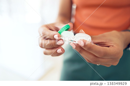 Hands, contact lenses and vision, health and eye care with cosmetic or medical. Person with plastic case, visual and eyesight improvement, closeup and optometry with solution and ophthalmology Hands, contact lenses and vision, health and eye care with cosmetic or medical. Person with plastic case, visual and eyesight improvement, closeup and optometry with solution and ophthalmology 138349929