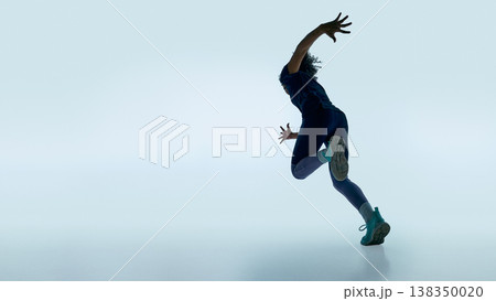 Teen female runner jumping forward in studio with clean minimal background and strong motion pose Teen female runner jumping forward in studio with clean minimal background and strong motion pose 138350020