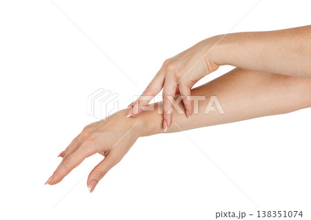 Beautiful female hands with french manicure on nails isolated Beautiful female hands with french manicure on nails isolated 138351074