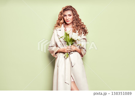Young woman in white spring coat Young woman in white spring coat 138351089