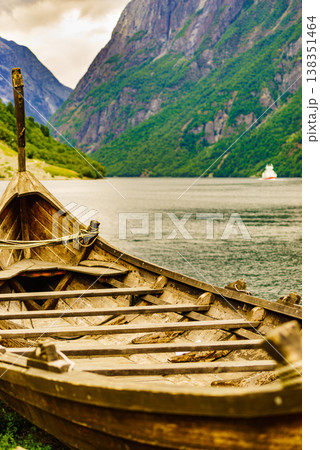 Old viking boat and ferryboat on fjord, Norway 138351464