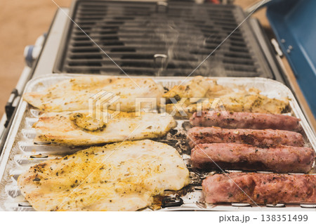 Sausages and chicken meat on grill Sausages and chicken meat on grill 138351499