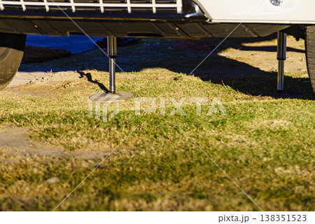 Camper leveling support leg in use. Camper leveling support leg in use. 138351523