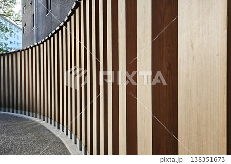 Wooden battens mounted on an underlying aluminum structure wall Wooden battens mounted on an underlying aluminum structure wall 138351673