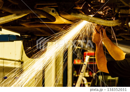 Mechanic grinding car body by grinder Mechanic grinding car body by grinder 138352031