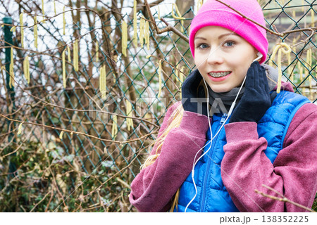 Woman wearing sportswear exercising outside during autumn Woman wearing sportswear exercising outside during autumn 138352225