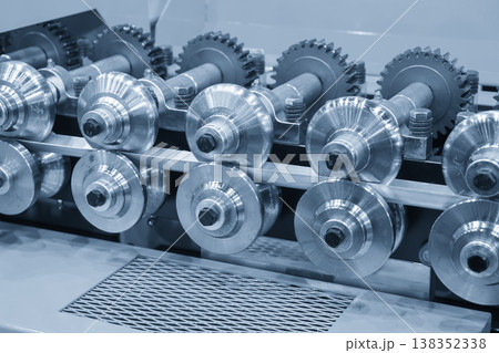 Industrial cold rolling process for high-precision metal forming and sheet steel production in a modern factory. Industrial cold rolling process for high-precision metal forming and sheet steel production in a modern factory. 138352338