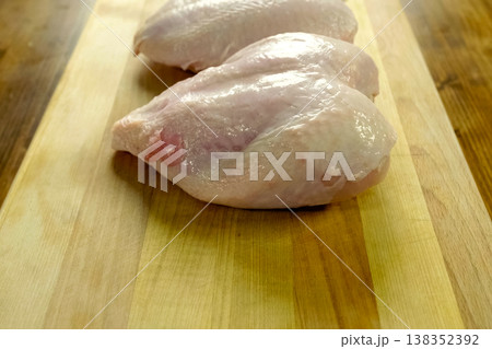 Broiler breast, chicken meat on cutting board 138352392