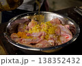 pour chicken meat with sunflower oil. meat 138352432