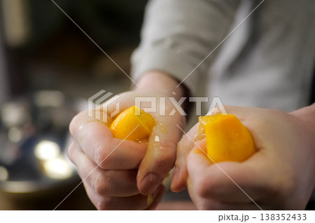 Hand squeezing lemons, lemon seasonings, lemon 138352433