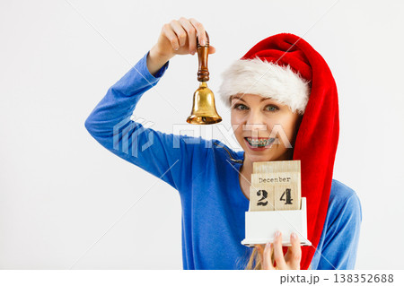 Woman and christmas calendar with bell Woman and christmas calendar with bell 138352688