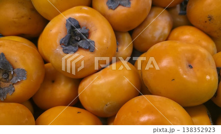 Fresh persimmon close-up full frame orange fruit 138352923