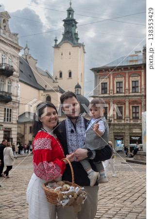 Father lifting toddler in historic european town square Father lifting toddler in historic european town square 138353429