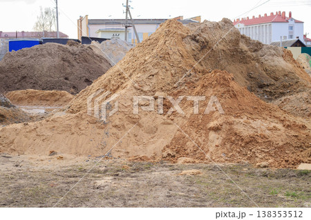 Heaps of sand and soil at an outdoor construction site. Heaps of sand and soil at an outdoor construction site. 138353512