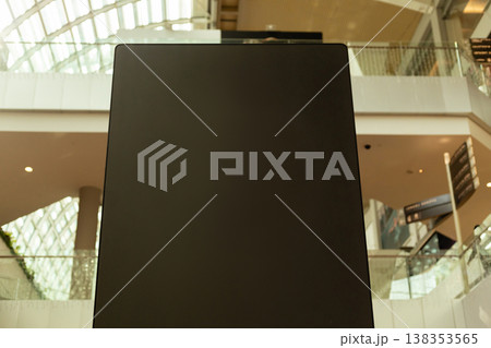 Storefront features a large, empty area for logo placement. Located inside a mall, the space awaits branding and attracts customer interest while remaining unoccupied Storefront features a large, empty area for logo placement. Located inside a mall, the space awaits branding and attracts customer interest while remaining unoccupied 138353565
