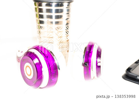 Hearing aids surround a metal container 138353998