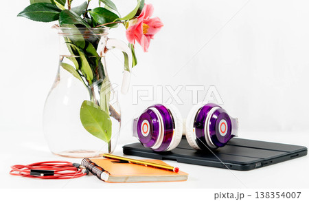 Purple headphones on a table 138354007