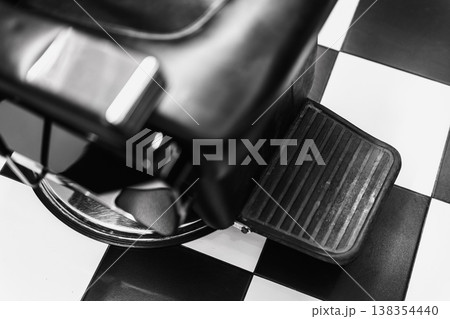 Vintage Barber Chair. Black And White Vintage Aesthetic With Industrial Elements And Rubber Padding 138354440