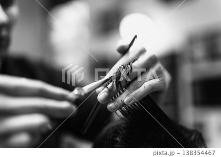 Precise Grooming Skills. Skillful Barber Shaping Hair. Closeup Of Barber Using Scissors Carefully Precise Grooming Skills. Skillful Barber Shaping Hair. Closeup Of Barber Using Scissors Carefully 138354467