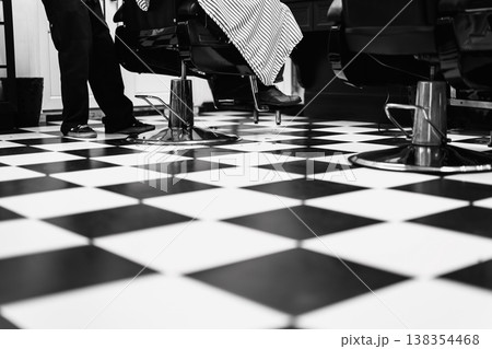 Retro Style Barbershop Ambiance. Monochrome Scene Featuring Classic Chairs And Timeless Atmosphere Retro Style Barbershop Ambiance. Monochrome Scene Featuring Classic Chairs And Timeless Atmosphere 138354468