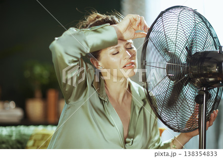 Sweaty Woman Desperate for Cooling Air 138354833