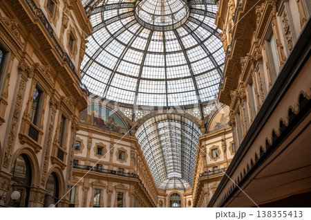Iconic glass dome and elegant neo renaissance architecture defining the historic galleria vittorio emanuele ii, a renowned shopping gallery and tourist attraction in milan Iconic glass dome and elegant neo renaissance architecture defining the historic galleria vittorio emanuele ii, a renowned shopping gallery and tourist attraction in milan 138355413
