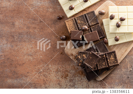 Assortment of white, milk and dark chocolate pieces 138356611