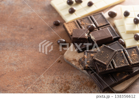 Assortment of white, milk and dark chocolate pieces Assortment of white, milk and dark chocolate pieces 138356612