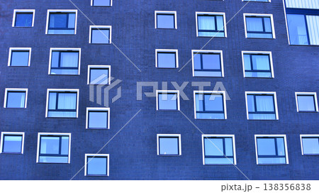 Apartments in residential complex. Housing structure at modern house.  Architecture for property investment. and architecture details. Urban abstract - windows of apartment building. 138356838