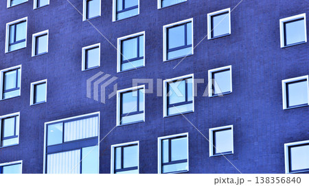 Apartments in residential complex. Housing structure at modern house. Architecture for property investment. and architecture details. Urban abstract - windows of apartment building. Apartments in residential complex. Housing structure at modern house. Architecture for property investment. and architecture details. Urban abstract - windows of apartment building. 138356840