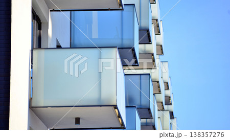 Apartments in residential complex. Housing structure at modern house.  Architecture for property investment. and architecture details. Urban abstract - windows of apartment building. 138357276