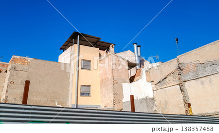 Old Buildings Behind Metal Construction Fence Old Buildings Behind Metal Construction Fence 138357488