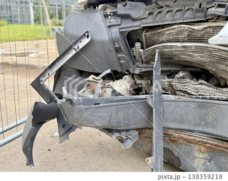 This minibus was significantly damaged as a result of a serious head-on collision. A seriously damaged grey minibus, which shows significant collision marks in the front and extensive rust marks. This minibus was significantly damaged as a result of a serious head-on collision. A seriously damaged grey minibus, which shows significant collision marks in the front and extensive rust marks. 138359219