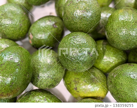 Large rifle green avocados harvested ready to eat are sold on supermarket shelves top view. Healthy eating. Close-up. 138359255