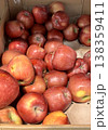 A vibrant and colorful display of fresh, crisp red apples organized neatly in a bustling market settings. Close-up. 138359411