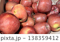 A vibrant and colorful display of fresh, crisp red apples organized neatly in a bustling market settings. Close-up. 138359412