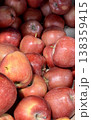 A vibrant and colorful display of fresh, crisp red apples organized neatly in a bustling market settings. Close-up. 138359415