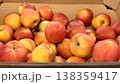 A vibrant and colorful display of fresh, crisp red apples organized neatly in a bustling market settings. Close-up. 138359417