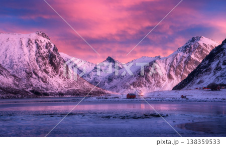 Beautiful snow covered mountains and purple sky with pink clouds 138359533