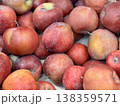 Box filled with fresh natural bio organic red apples placed on counter in local food market. Close-up 138359571