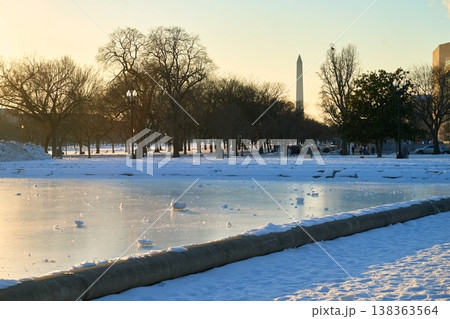 Capitol Reflecting Pool frozen in winter with Washington Monument obelisk at the background 138363564