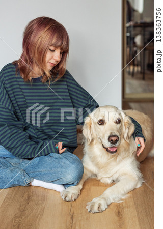 Young girl enjoying time with her golden retriever dog Young girl enjoying time with her golden retriever dog 138363756